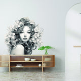 Woman with floral hair wall mural shown in a room setting.