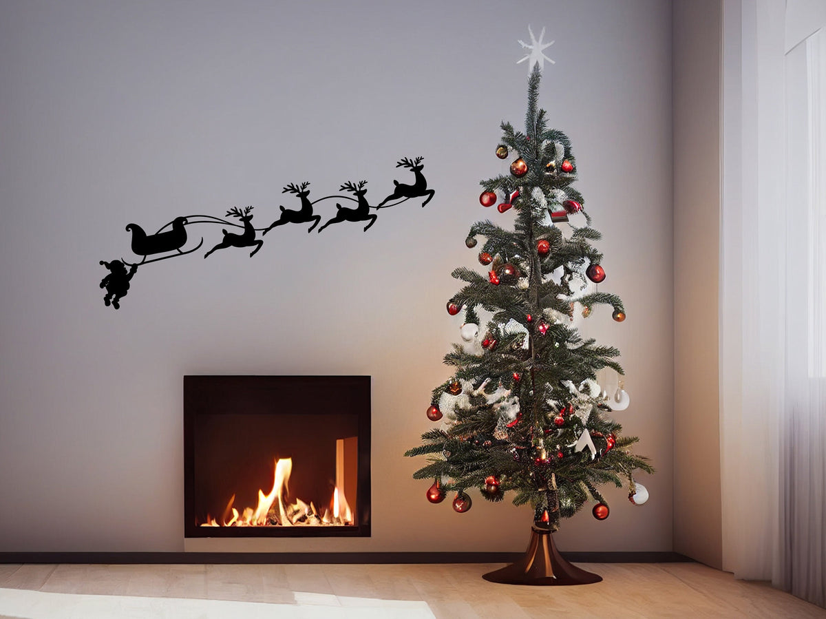 Santa, sleigh and reindeer silhouette vinyl wall decal displayed in a seasonal room.