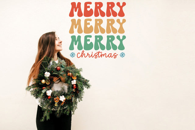 Merry Merry Merry Christmas wall decal shown in a room setting.