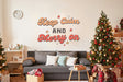 Keep Calm and Merry On Christmas wall decal shown in a room setting.