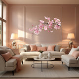 Pink cherry blossom branch vinyl wall decal displayed in a corner setting.