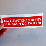 Set of four main DC switch equipment identification labels.