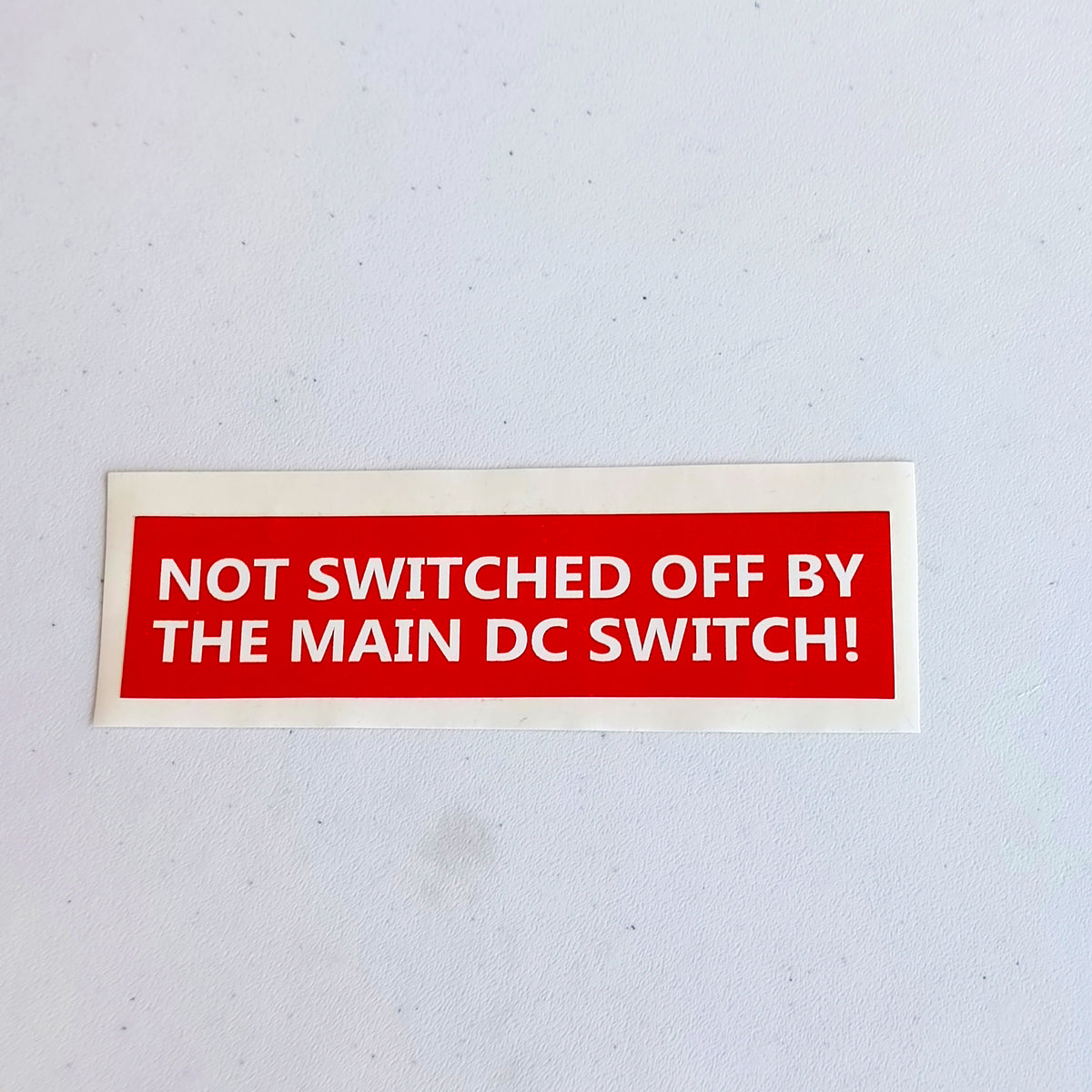 Main DC switch equipment identification label shown as a product close-up.