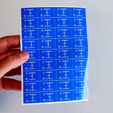 Product view of Blue Grounding Symbol Stickers.