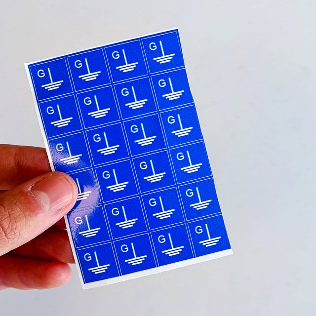 Product view of Blue Grounding Symbol Stickers.