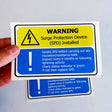 Product view of 6x Surge Protection Device (SPD) Warning Label.