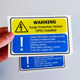Product view of 6x Surge Protection Device (SPD) Warning Label.