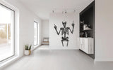 Anatomical skeleton figure vinyl decal displayed on a wall.