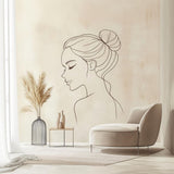 Minimalist line art wall decal of a woman's face in serene pose.