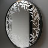 Custom etching of floral design on round mirror.
