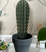 3D printed cactus toothpick holder in a pot with toothpicks resembling spines.