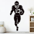 Football player wall decal, black silhouette running with football.