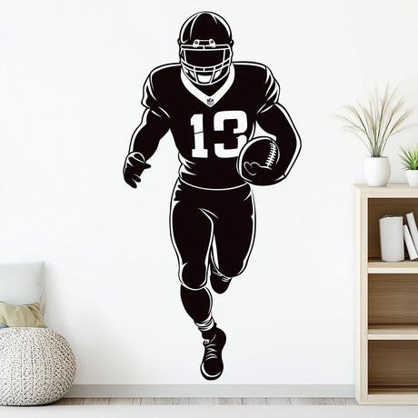 Football player wall decal, black silhouette running with football.
