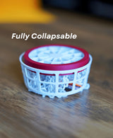 Collapsible mini disc golf basket designed for desktop play.