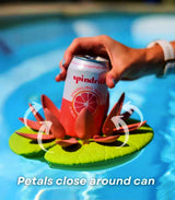 Floating lily pad cupholder stabilizing a drink can in a pool, featuring self-adjusting petals for secure hold.