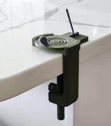 Compact clamp for securing objects to a table.