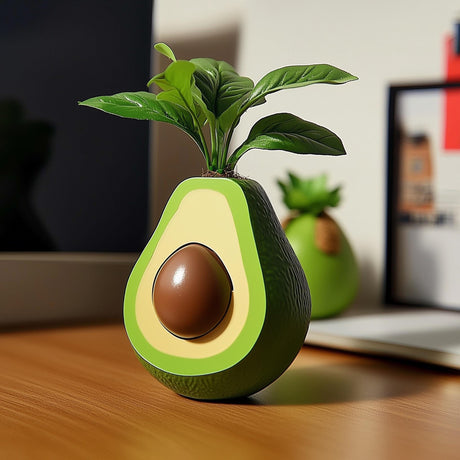 3D printed avocado-shaped plant pot with a rounded green body and central planting opening.