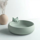 Cute green cat-shaped bowl with minimalist design.