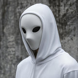 Minimalist 3D printed phantom mask with a smooth faceless surface and narrow eye openings.