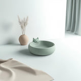3D printed cat bowl with cute kitty design in a modern pet space.