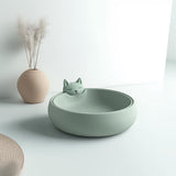 Cute 3D printed cat bowl in mint green, featuring a minimalist sleeping cat design.