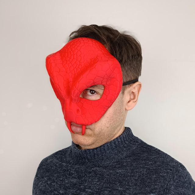 3D printed snake demon mask with scaly reptilian texture, sculpted fangs and narrow eye openings.