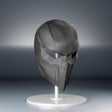Black 3D printed futuristic tactical face mask with angular panels and narrow eye openings.
