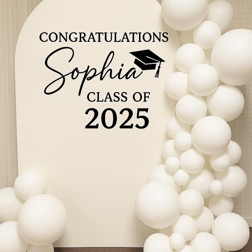 Personalized name and year graduation decal on a balloon arch backdrop.