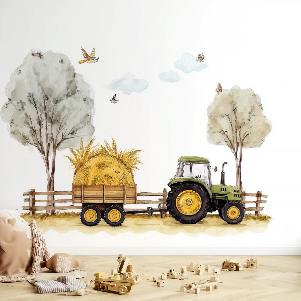 A farm-themed nursery wall decal showing a green tractor pulling a hay-loaded wooden trailer along a dirt path.
