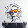 Wall decal of a woman with short wavy white hair and vivid orange reflective sunglasses in comic-style illustration.