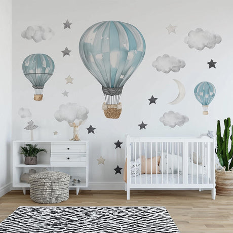 Dreamy nursery with hot air balloon wall decals, watercolor clouds, and stars.
