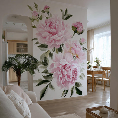 A bright, elegant living space with a large wall mural featuring soft pink watercolor peonies and green leaves.