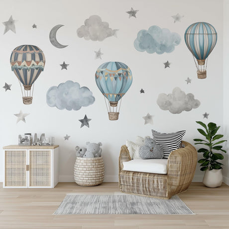 A boys’ nursery decorated with watercolor-style wall decals.