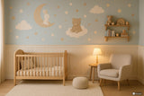 Vinyl nursery wall decal set featuring a bunny sitting on the moon, a bear on a cloud, fluffy clouds.