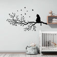 Vinyl wall decal of a cat sitting on a detailed tree branch with flying birds.