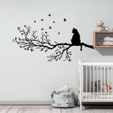 Vinyl wall decal of a cat sitting on a detailed tree branch with flying birds.