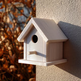 Light-colored 3D printed birdhouse with perch and removable roof made from matte PLA plastic.
