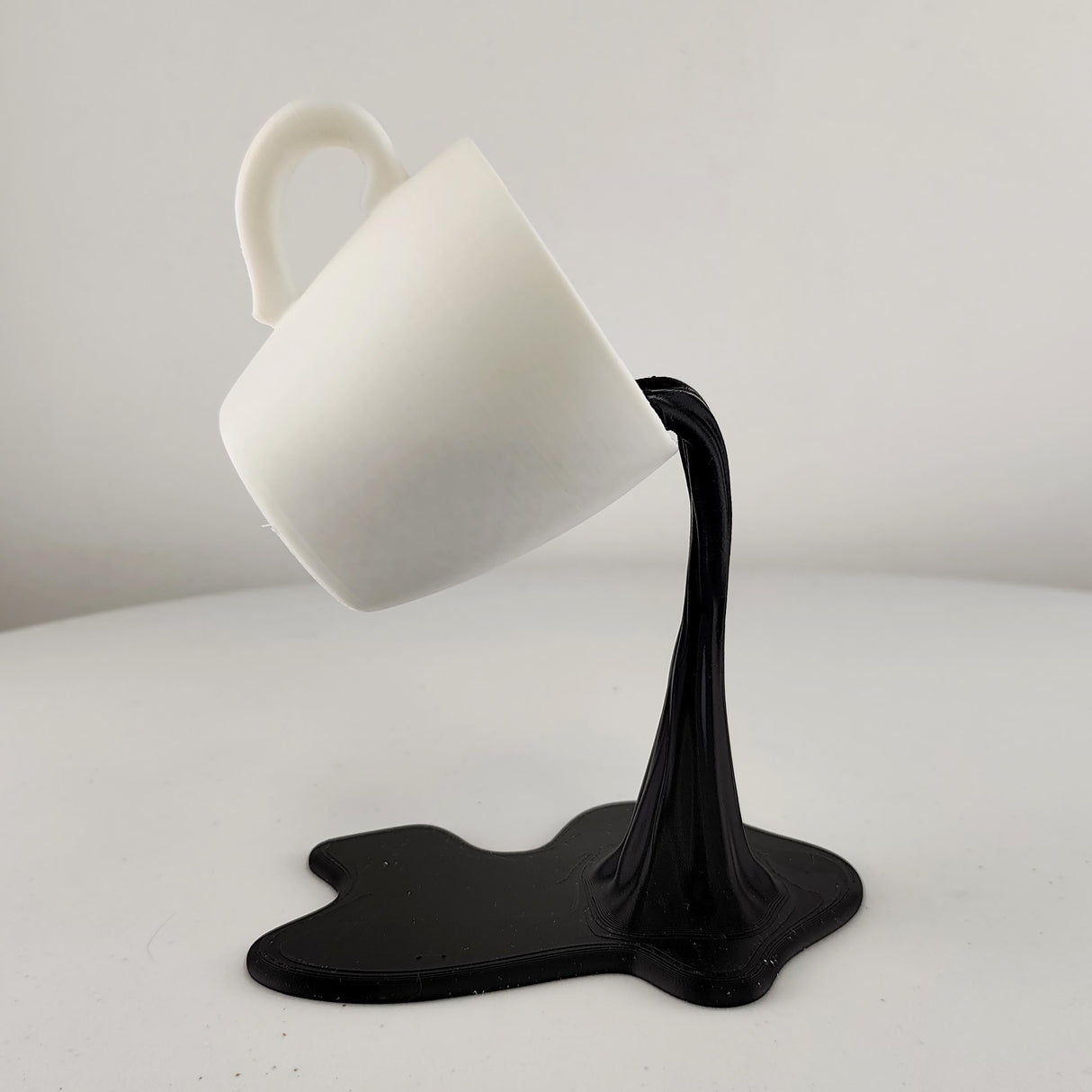 Product detail view of Floating Coffee Cup Sculpture.