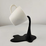 Product detail view of Floating Coffee Cup Sculpture.