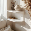 3D printed corner wall shelf in matte white PLA.