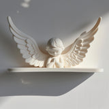 3D printed wall shelf with a minimalist praying angel figure and wide wings and matte white PLA.
