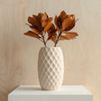 Cream-colored 3D printed vase with a diamond-patterned geometric texture.