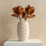 Cream-colored 3D printed vase with a diamond-patterned geometric texture.