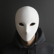 Smooth 3D printed blank face mask with simple eye openings and a minimalist expression.