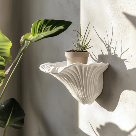 A matte white 3D printed wall shelf inspired by the shape of a mushroom (Artist’s Conk).