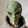3D printed alien face mask with smooth organic shape, worn by an adult model indoors.