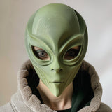 3D printed alien face mask with smooth organic shape, worn by an adult model indoors.