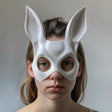 Adult model wearing a white 3D printed bunny mask with tall ears and smooth rounded facial contours.