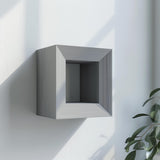 Square-frame 3D printed wall shelf with a geometric ledge for small decor.