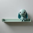 3D printed wall shelf with an integrated bunny character and a small plant pot beside it.